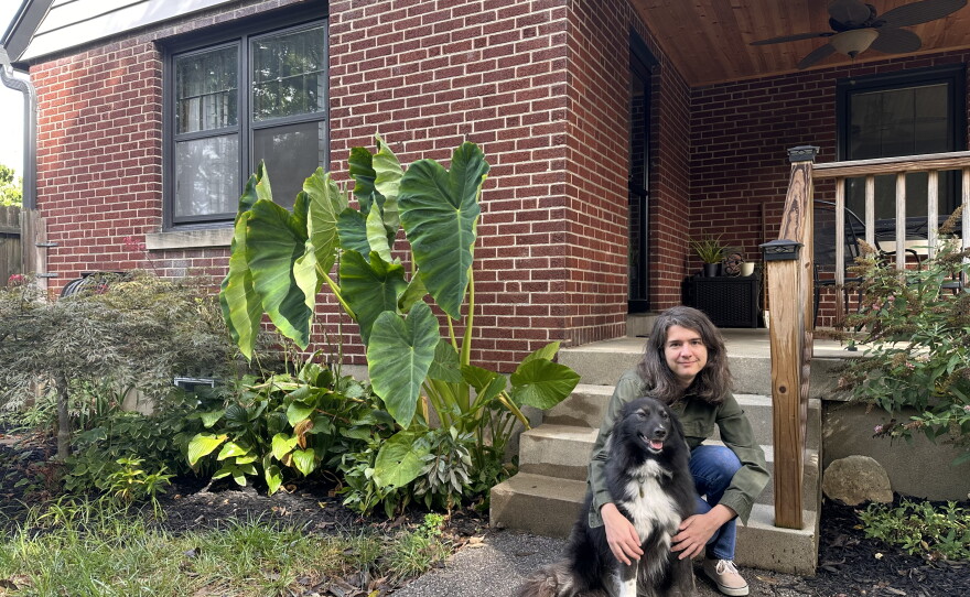 Kelly MacDonald holds her dog in front of her five bedroom home in a Cincinnati suburb on September, 11 2026.