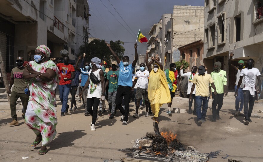 Demonstrators protest President Macky Sall decision to postpone the Feb. 25 vote.