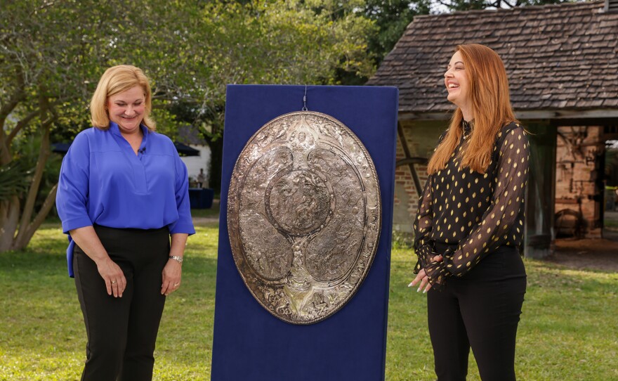 LaGina Austin (left) appraises an Elkington & Co. <i>Milton Shield</i> model, ca. 1868, in Baton Rouge, LA. ANTIQUES ROADSHOW “LSU Rural Life Museum, Hour 3” airs Monday, March 25 at 8/7C PM on PBS.