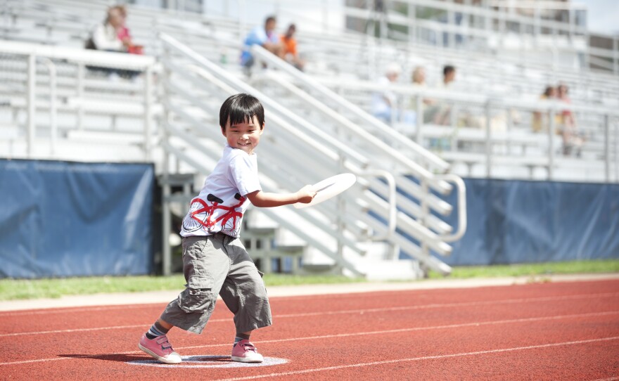 Fans of all ages showed their support for Ultimate Frisbee, including 5-year-old Justin Yi. Justin's father, Peter, has been playing Ultimate Frisbee since he was in college.