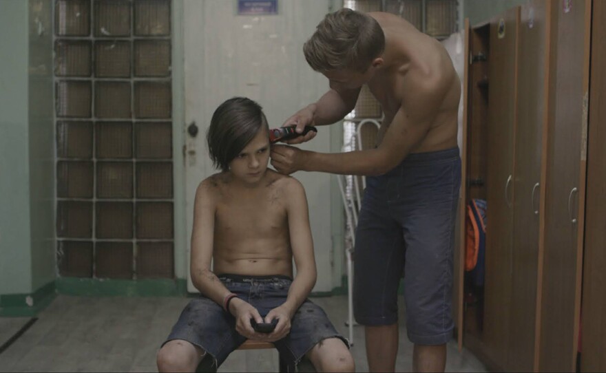 Vlad gives Kolya a haircut