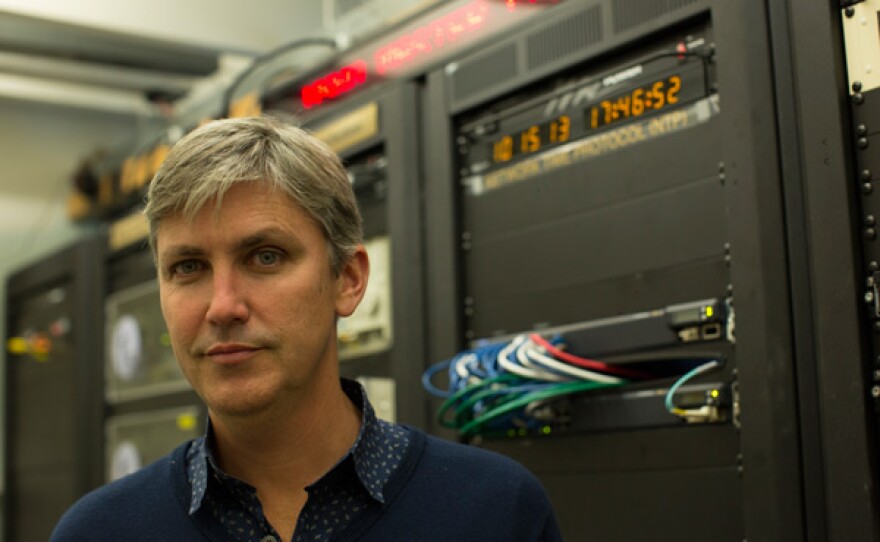 Steven Johnson with master clock at Directorate of Time Washington, D.C.