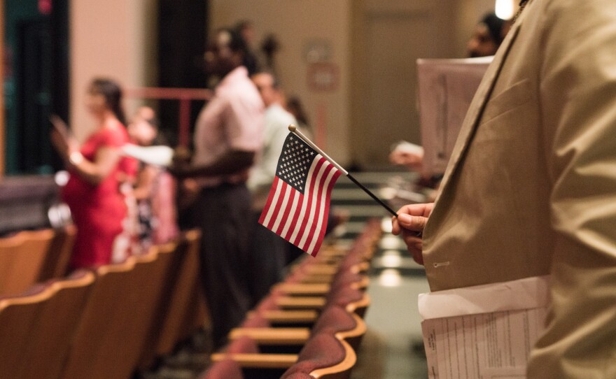 Newly sworn-in U.S. citizens stand during a naturalization ceremony in Alexandria, Va., in August. The Census Bureau is planning to test how a question about U.S. citizenship status the Trump administration added will affect responses to the 2020 census.
