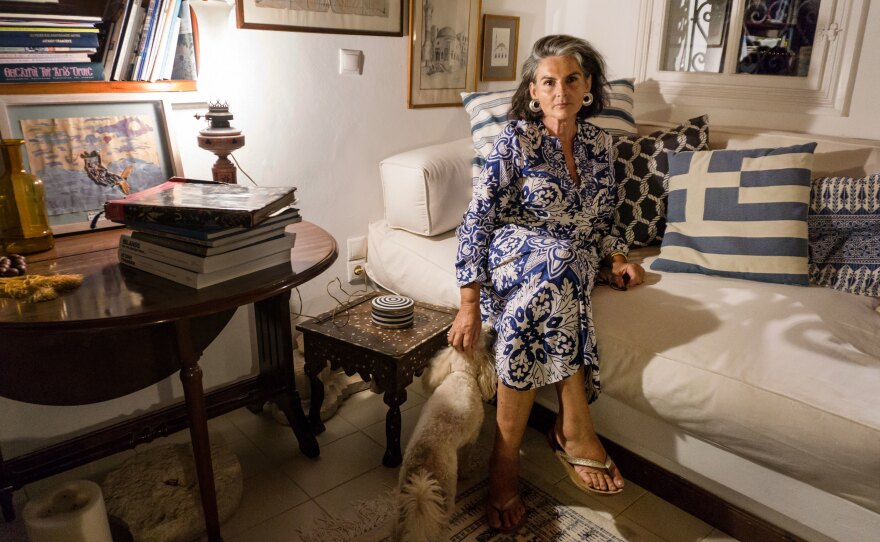 Constantina Agapitou Crowley, a former marketing executive and sixth-generation Kastellorizian, serves as the island's ambassador-at-large. She is pictured at home with her dog, Zoe.