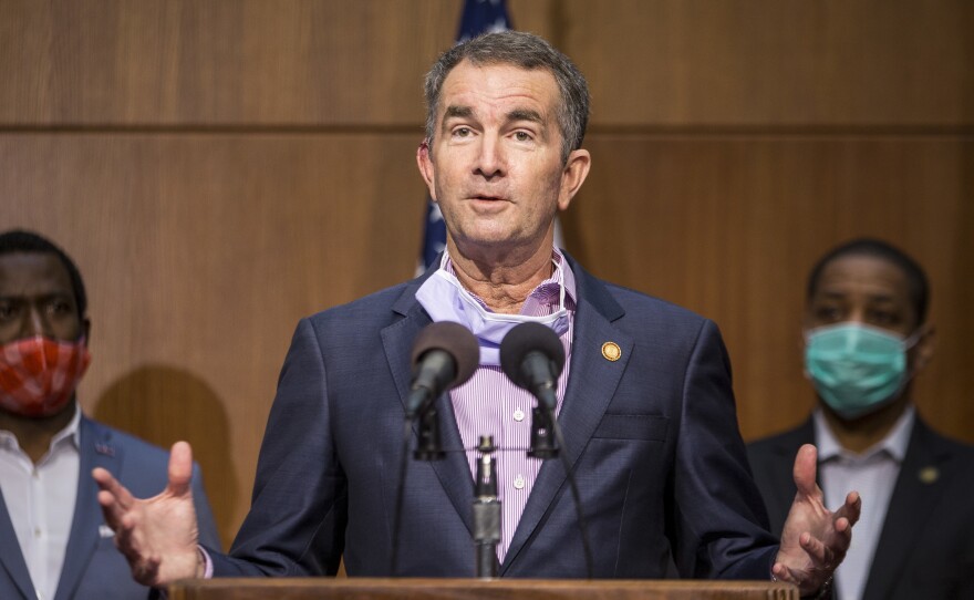 Virginia Gov. Ralph Northam was mentioned as a potential target for kidnapping when a group met to discuss plots to punish governors for their response to the coronavirus. Northam is seen here at a news conference this summer.