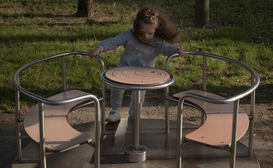 Milana Dorosh plays at the park in Rovigo, Italy, in April 2022. Milana, her mother and brother escaped to this town after war broke out in Ukraine.