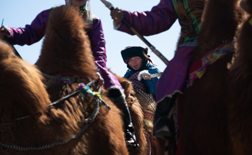 Enkhbaatar waits his turn to promenade in the camel beauty pageant. Lots of pictures are taken, which will allow future generations to have photographic proof of the herders' lifestyle.<strong></strong>