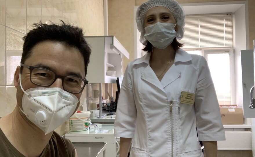 This week NPR Moscow correspondent Lucian Kim got vaccinated with Sputnik V, the COVID-19 vaccine that Russian President Vladimir Putin is promoting as the best in the world. Above: Kim smiles (behind his mask) after his shot.