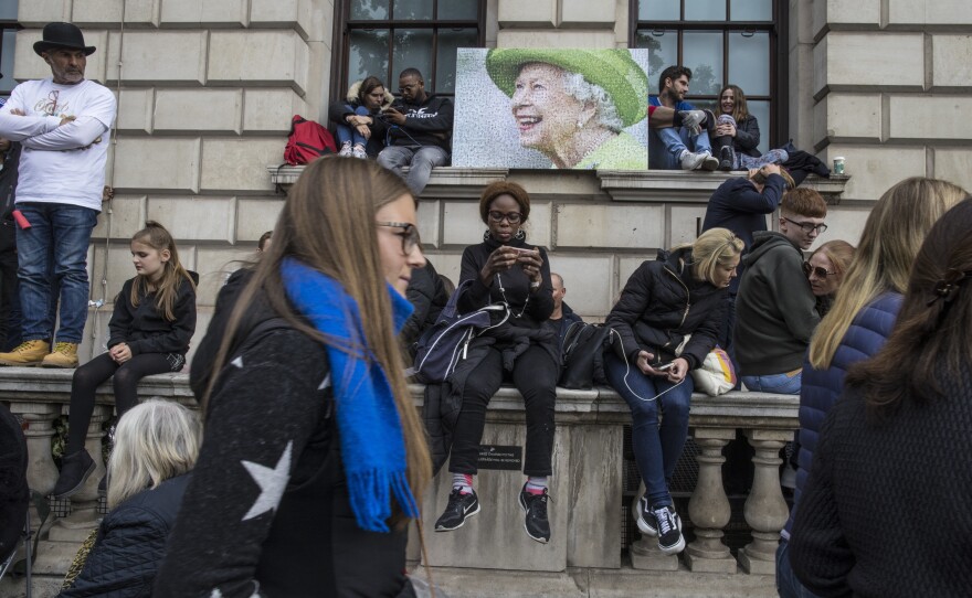 A picture of Queen Elizabeth II sits outside the Palace of Westminster and the houses of parliament where the funeral procession took place in London on Monday.