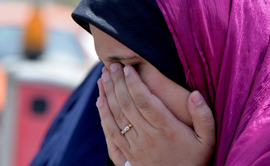 A relative of a passenger on EgyptAir Flight 804 cries at Cairo International Airport as she tries to get information about the plane's fate.