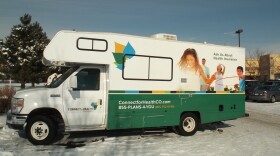 The Colorado health exchange van stops at a shopping center in Fort Collins.