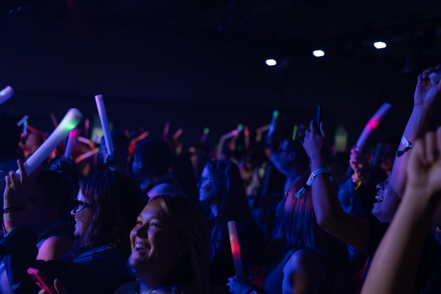 A crowd of TwitchCon attendees jumps and cheers during Diplo's set at the TwitchCon Opening Ceremony in downtown San Diego on Oct. 17, 2025.