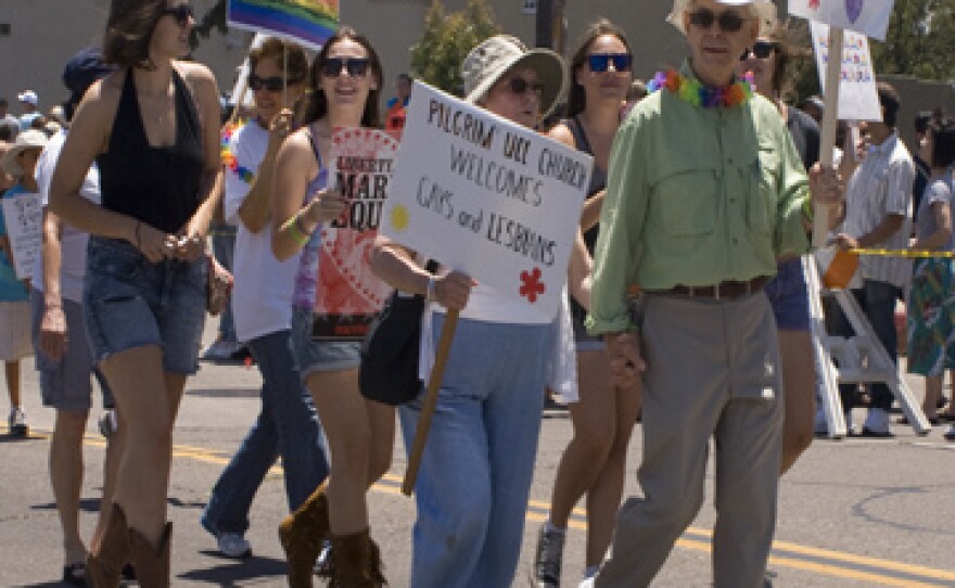 People walk in the San Diego Gay Pride Parade in July 2010.