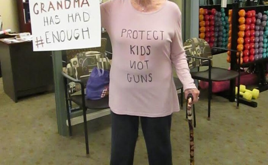 Barbara Applebee, 87, holds up her sign during a march for gun control at Seacrest Village retirement community in Encinitas in solidarity with the national youth march, March 24, 2018.