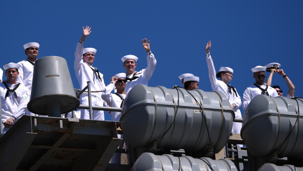 Sailors wave aboard the USS Abraham Lincoln aircraft carrier as it returns to Naval Air Station North Island after deployment Thursday, Oct. 8, 2026, in Coronado, Calif.