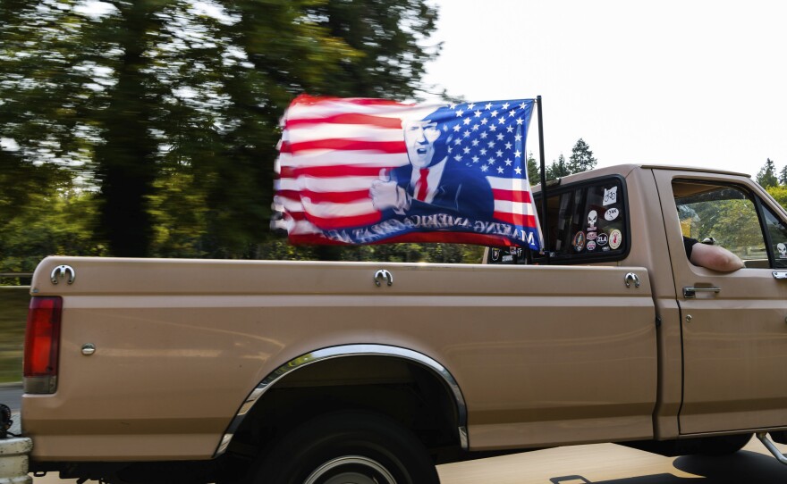 A caravan of vehicles make their way along the Interstate 205 South freeway during the "Oregon for Trump 2020 Labor Day Cruise Rally," at Clackamas Community College in Oregon City, Ore., on Sept. 7, 2020.