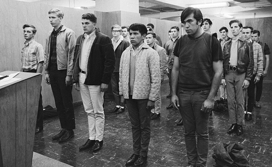 Young men are sworn in and drafted into the Vietnam War. (undated photo)