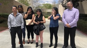 Gerardo Martinez Sr. (left) stands with family and friends outside of Vista Superior Court, May 15, 2018.