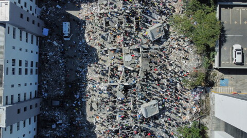 Residents and rescue workers search through the rubble after an earthquake struck Cali, Colombia, Monday, Aug. 10, 2026.