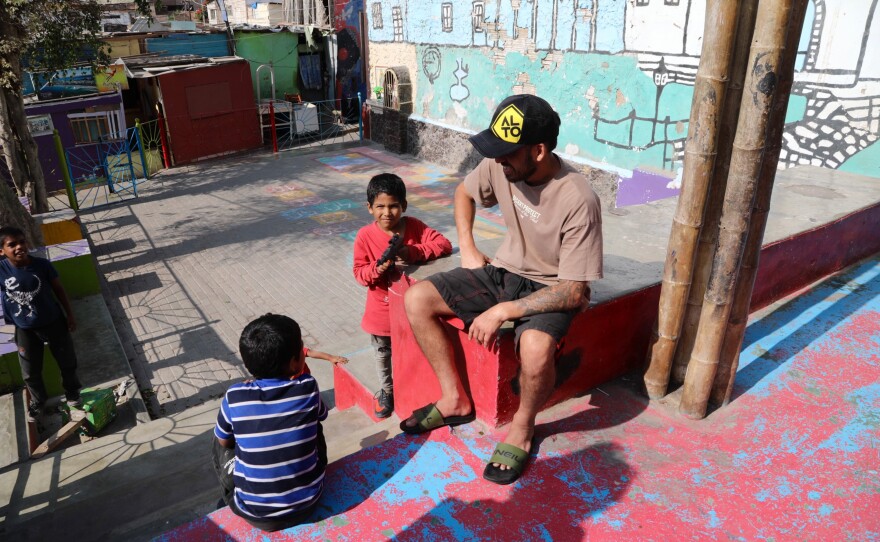 Founder Diego Villarán with kids in a playground built by Alto Peru, the nonprofit group that he heads up.