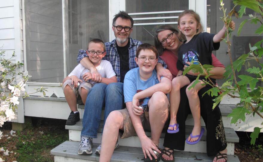 The Drehers — Lucas (from left), Rod, Matthew, Julie and Nora — sit on the side stoop at their new home in St. Francisville, La.
