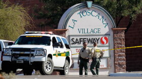 Law enforcement  officials were still trying to piece together a chronology of events and  a possible motive  for Saturday's shooting rampage at a Safeway in  Tucson, Ariz.