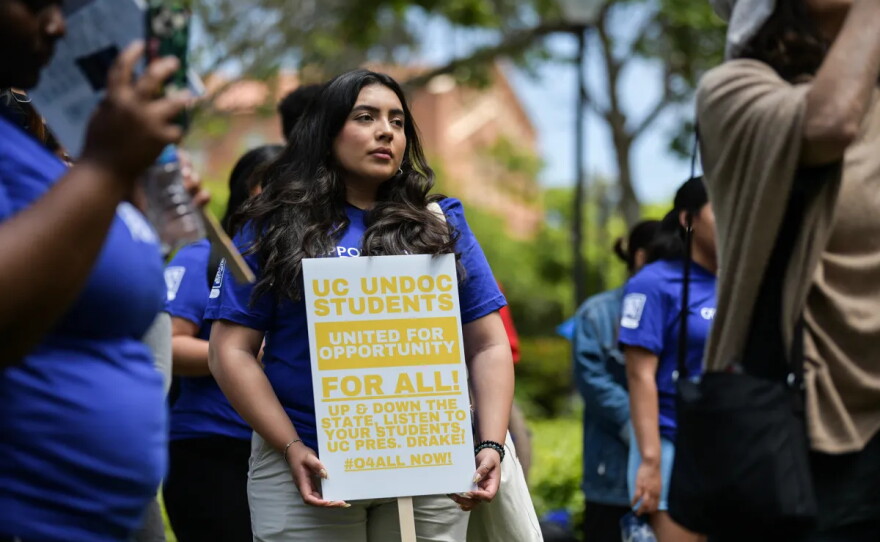 Students rally in support of undocumented students, urging University of California leaders to remove hiring restrictions for them, in front of Kerckhoff Hall at UCLA in Los Angeles on May 17, 2023.