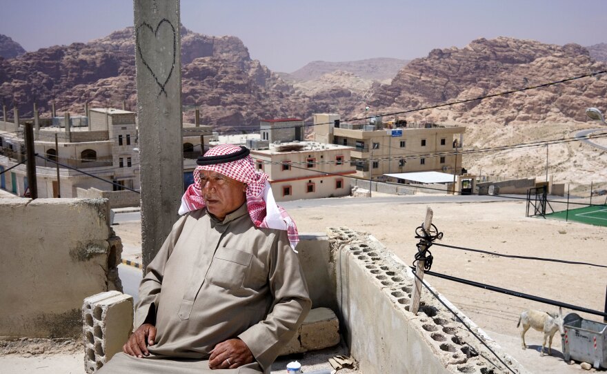 Bedouin village elder Ali Mutlaq Salem sits on his roof in the village of Um Sayhoun, on the outskirts of Petra. Salem was born and raised in one of the caves in Petra.