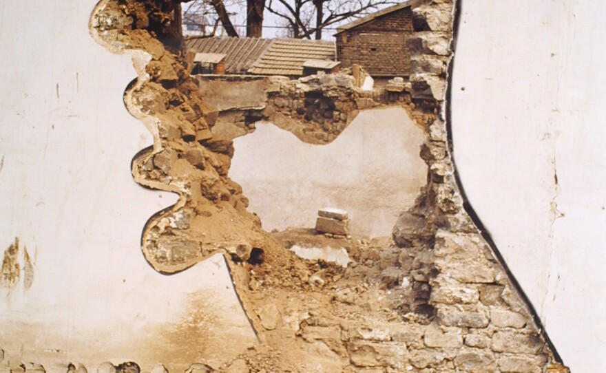 Zhang Dali; Demolition 2, 1999. Zhang's artwork was ubiquitous in the late 1990s around Beijing's countless demolition sites as miles and miles of old housing was destroyed.