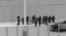 This file image from video provided by the Yuma Sector Border Patrol shows a group of migrants who crawled through a hole that had been dug under the U.S.-Mexico border wall at the San Luis port of entry near Yuma, Ariz., on Wednesday, Nov. 7, 2018. 