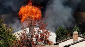 Flames engulf the rented home of George Jura Jakubec after it was set ablaze by officials December 9, 2010 in Escondido, California.