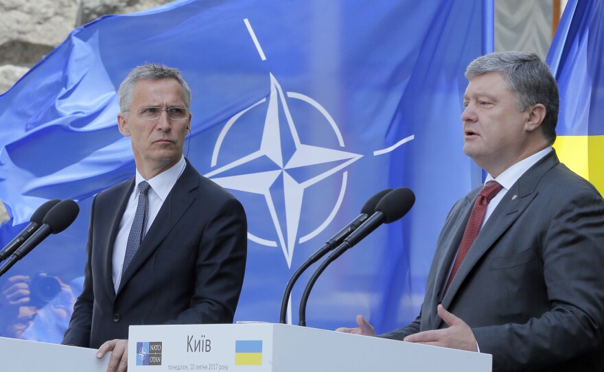 Ukrainian President Petro Poroshenko, right, and NATO Secretary General Jens Stoltenberg attend a joint news conference in Kiev on Monday.