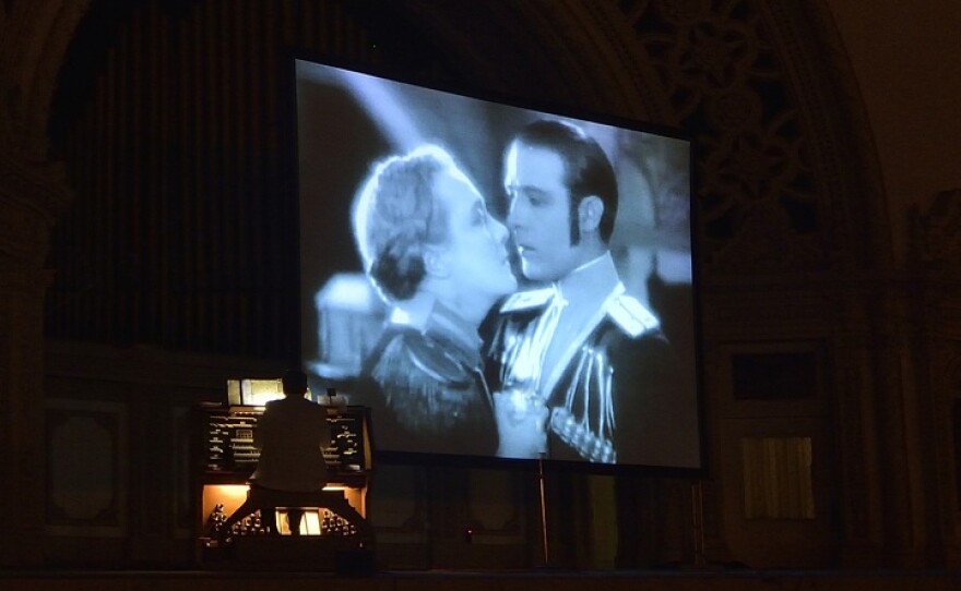 An organist accompanies "The Eagle," starring Rudolph Valentino, at the Spreckels Organ Pavilion in Balboa Park on Silent Film Night last summer, Aug. 19, 2013.