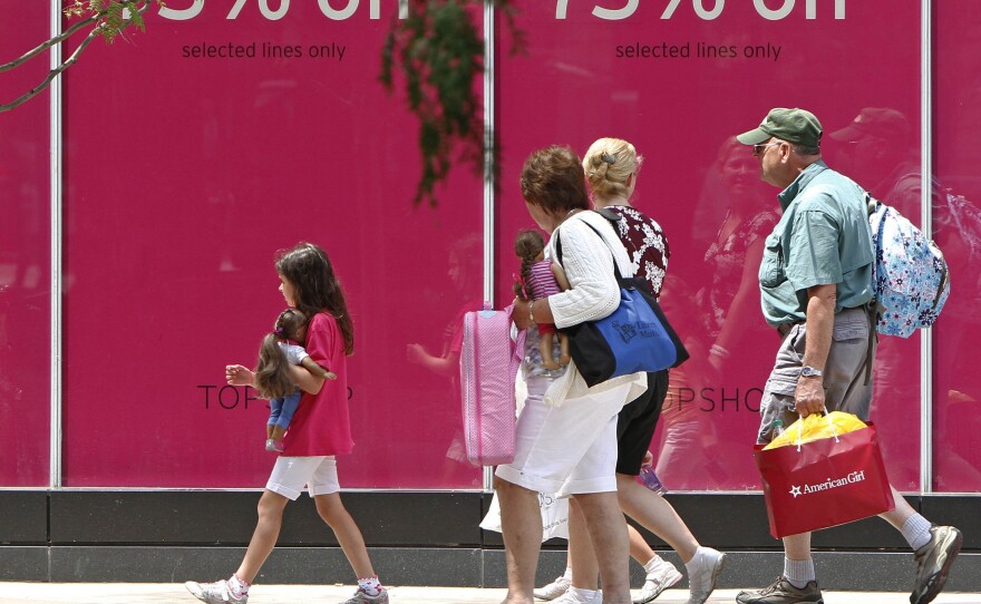 Shoppers walk along Chicago's Michigan Avenue last month.