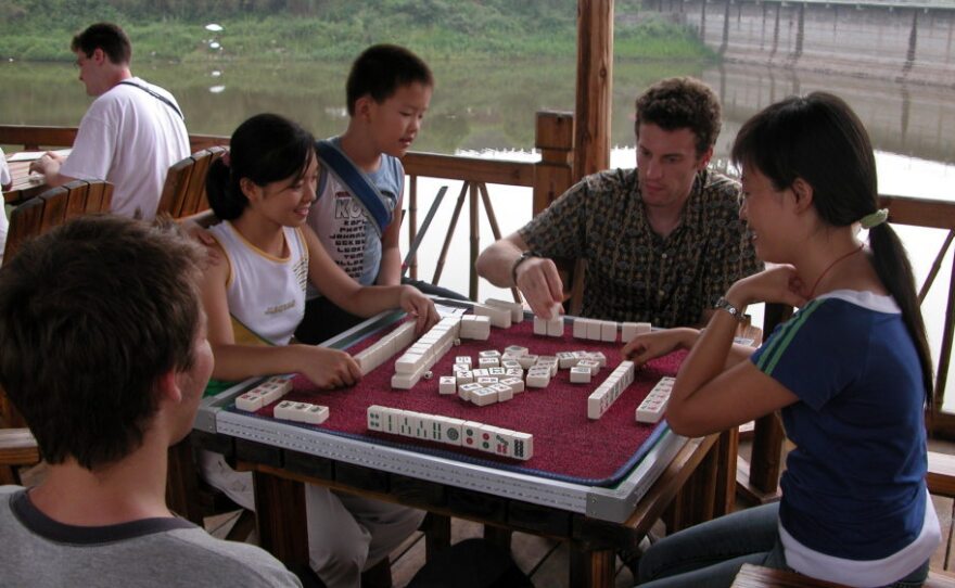 Michael Levy enjoys a game of Mahjiang with local youth.
