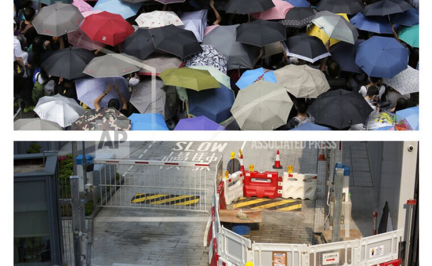 This combination of Sept. 27, 2014 (top) and Sept. 26, 2015 photos shows a protester holding a placard that reads "Occupy Central" between police and protesters outside the government headquarters during the Umbrella Movement in Hong Kong, and the same area almost a year later.