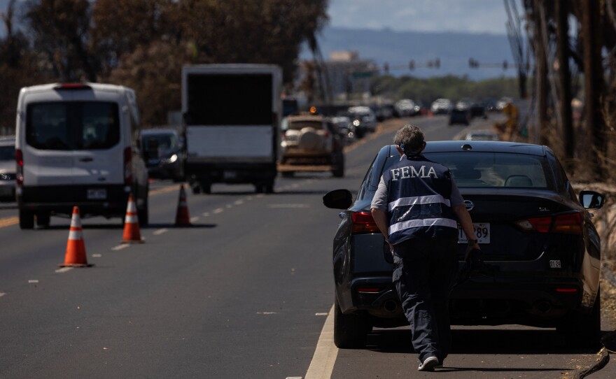 A Federal Emergency Management Agency official in the aftermath of the Maui wildfires in Lahaina, Hawaii, on Aug. 18, 2023. Even before social media, FEMA's manuals emphasize the importance of getting reliable information out to reduce the impact of rumors.