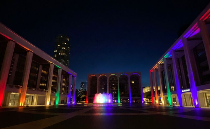 An empty Josie Robertson Plaza at Lincoln Center, lit up in June for Pride 2020 — but with no concert attendees or theatergoers, due to the coronavirus pandemic.