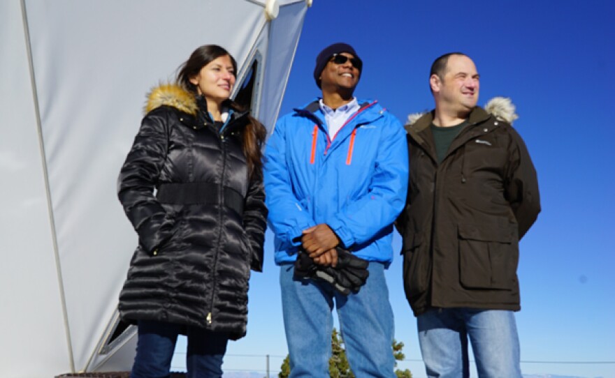 Marisol, Norman and Paul on top of Mount Lemmon observatory. This is as part of the final Demo where they have used atomic clocks to see the affects of gravity on time.