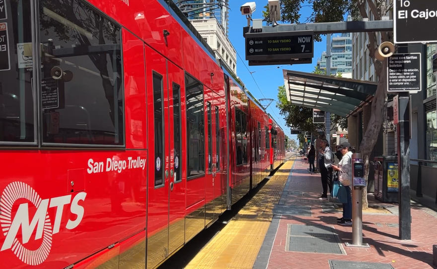 Riders wait to board the Blue Line trolley at the Fifth Avenue station in downtown San Diego on Wednesday, May 6, 2026.