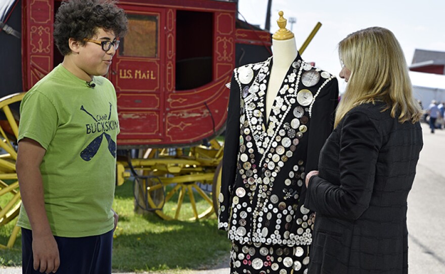 Katy Kane (right) appraises a mother-of-pearl button suit, ca. 1970 at Bonanzaville.