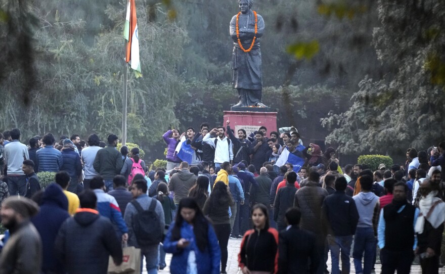 A group of students shout anti-government slogans as they are not allowed to screen a BBC documentary at Delhi University, Jan. 27. Tensions escalated at the university after a student group said it planned to screen the documentary examining Indian Prime Minister Narendra Modi's role during 2002 anti-Muslim violence, prompting dozens of police to gather outside campus gates.