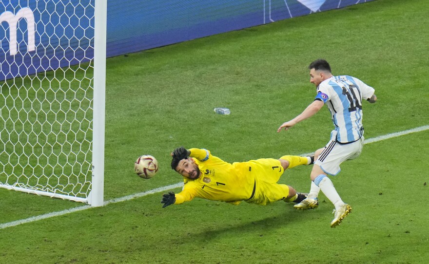 Argentina's Lionel Messi scores his team's third goal during the 2022 World Cup final with France on Sunday, Dec. 18, at the Lusail Stadium in Lusail, Qatar.
