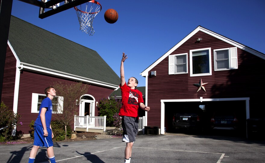 Chandler and Noah shoot hoops. Noah recently went on a school trip to Washington, D.C., without worrying or needing to call back home.