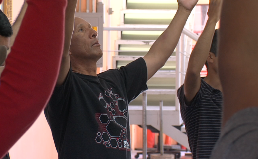 Deportees participate in a contemplative dance workshop at a Tijuana migrant shelter.