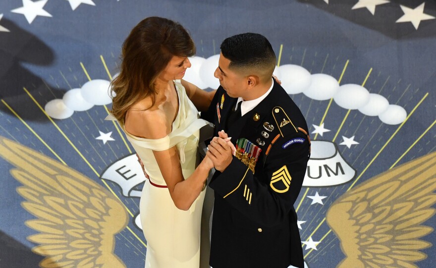 First lady Melania Trump dances with Army Staff Sgt. Jose A. Medina, who is from Ponce, Puerto Rico and served in Iraq and Afghanistan.