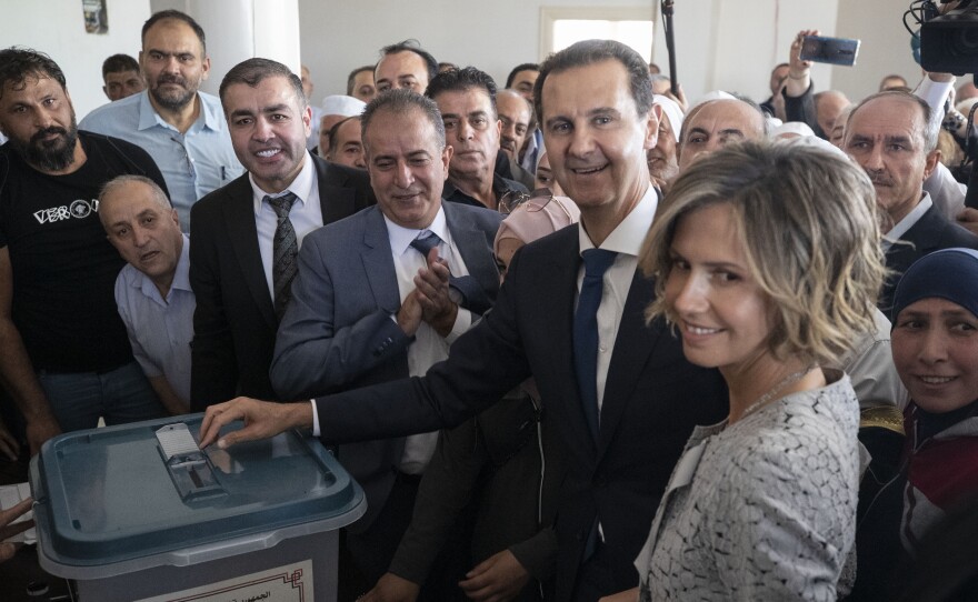 Syrian President Bashar al-Assad and his wife Asma vote at a polling station on Wednesday during the presidential elections in the town of Douma, near the Syrian capital Damascus.