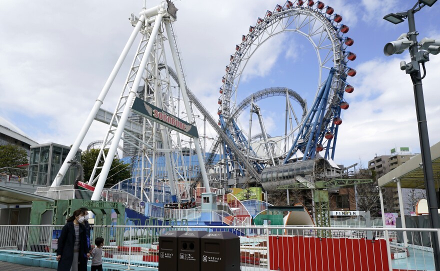 Japan's Tokyo Dome is shown before amusement rides began to reopen in the country. Japanese amusement park operators have asked people on rides at some parks not to scream.