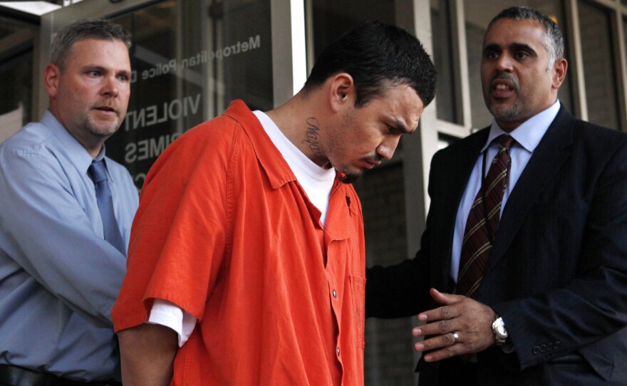 Ingmar Guandique is escorted from the Violent Crimes Unit by police in Washington, D.C., in 2009.