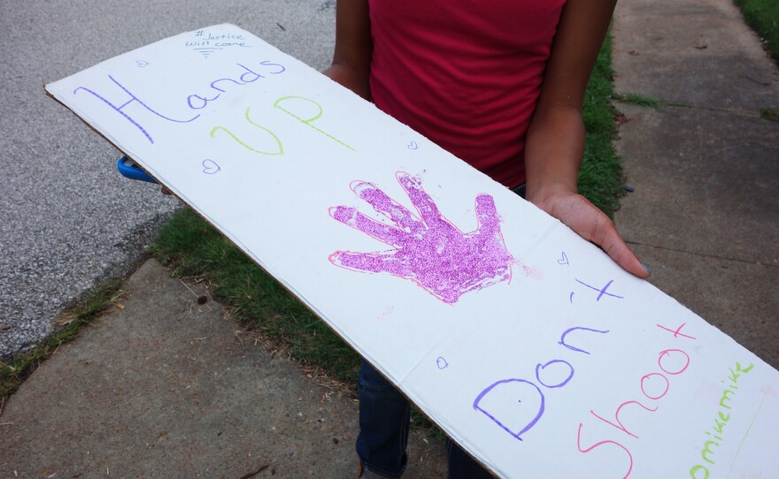 School children in Ferguson have participated in peaceful protests, even making their own glitter-adorned signs.